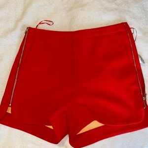 LUCY PARIS, gorgeous red. Size small shorts, gold hip to thigh side zip